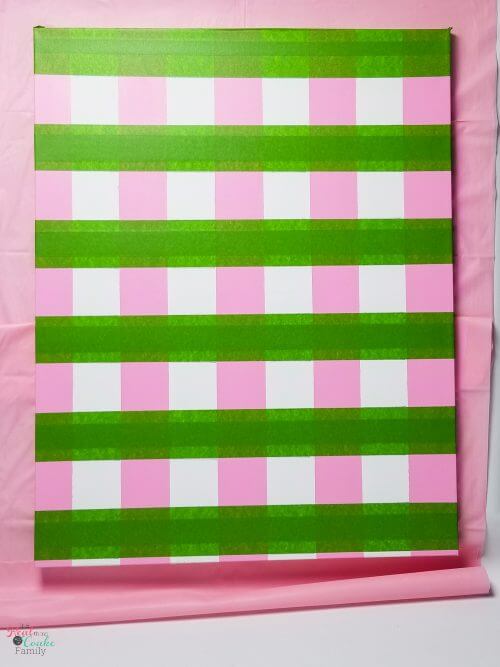 tape off second set of stripes Step by step tutorial on how to paint gingham and make the cutest wall art out of a craft store canvas. Perfect craft project to make DIY wall art.