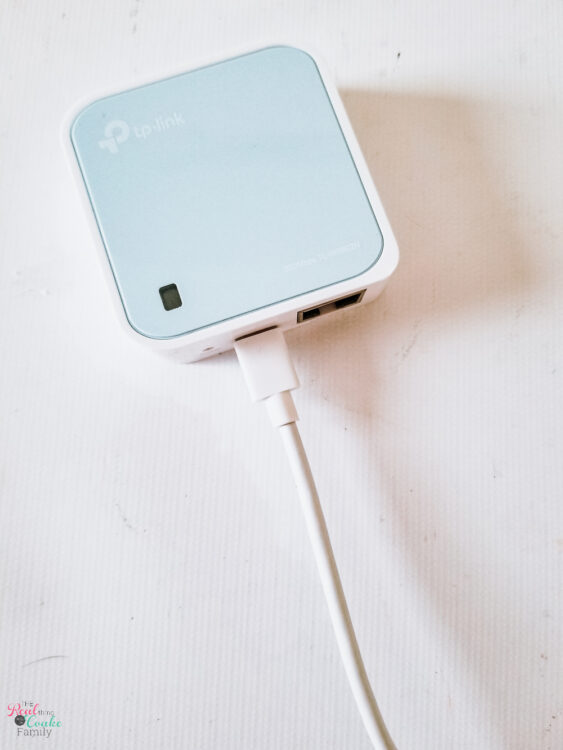 white and blue travel router List of travel accessories essential for a family road trip. Combo list of tech gadgets and accessories to make travel with the family easier and more fun.