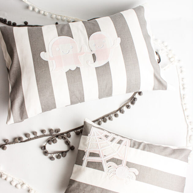 grey, white and pink halloween pillows